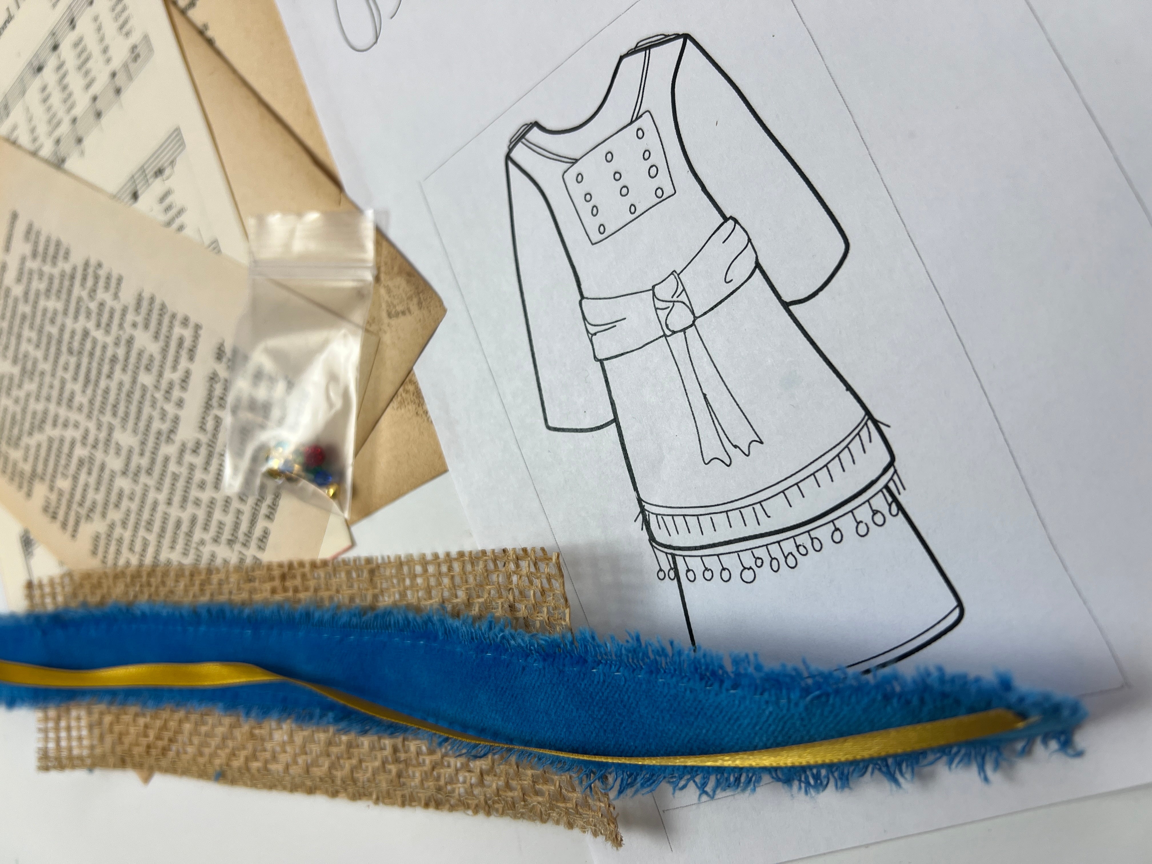 Black line drawing of a Priest on paper with Studio Stash Pieces.